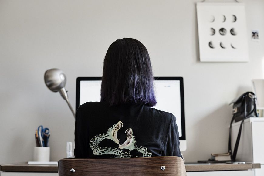 IMAGE: BTS - Joyce Ho working at desk