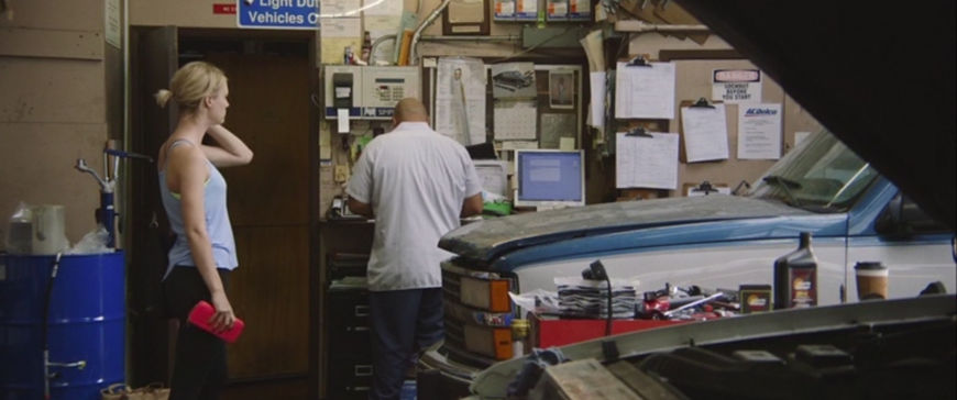 IMAGE: Still - Mackenzie Davis in garage with mechanic